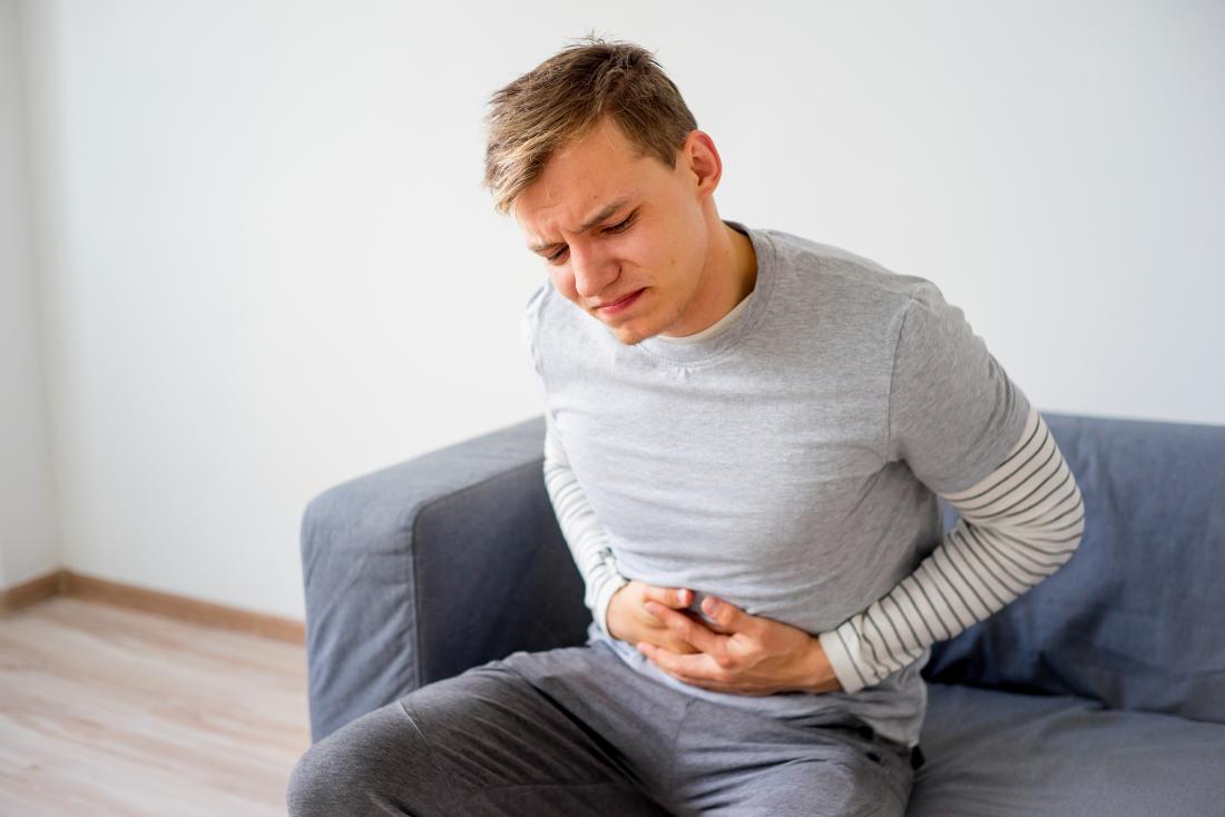 Man with stomach ache and gastrointestinal pain