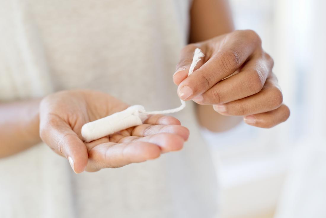 https://cdn-prod.medicalnewstoday.com/content/images/articles/322/322958/woman-with-tampon-in-hand-hoping-to-stop-periods-after-they-have-started.jpg