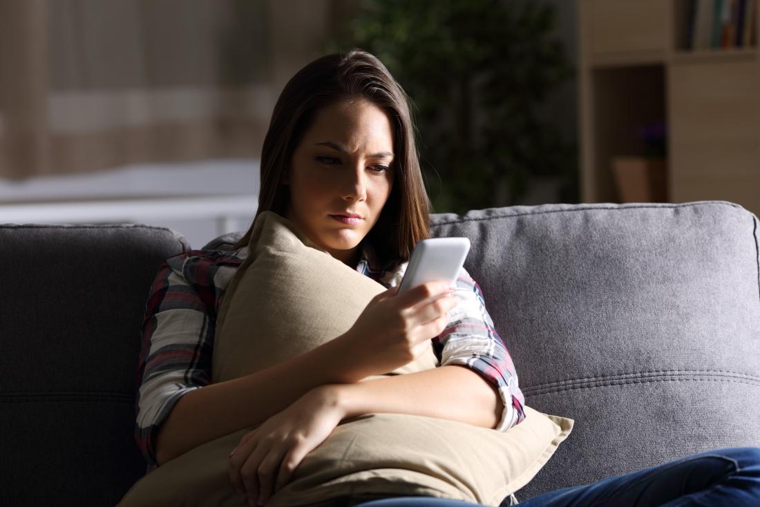 Sad woman on her phone