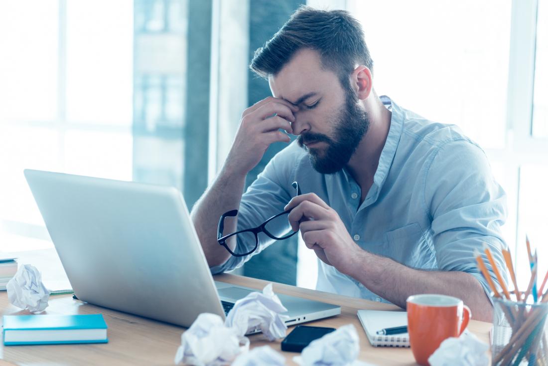 tired looking man at work