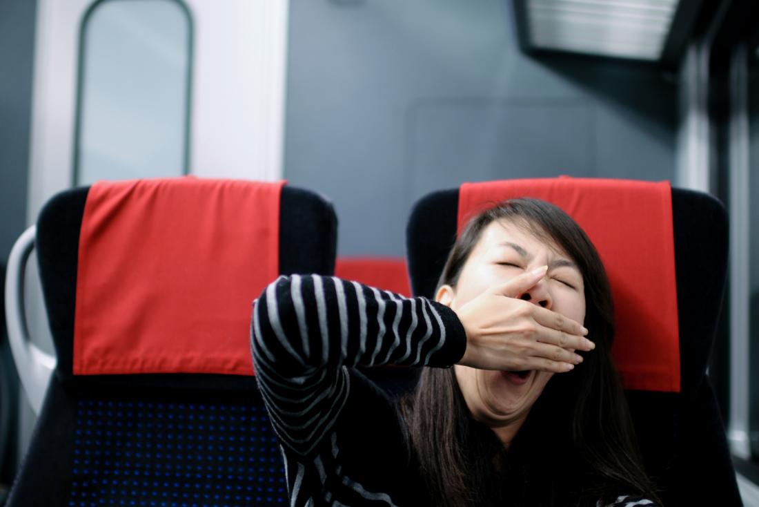 Tired woman on train