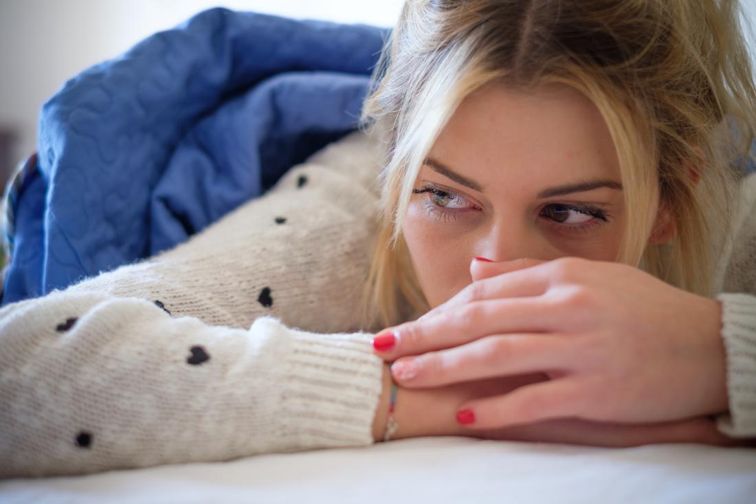Woman looking pensive due to a silent migraine