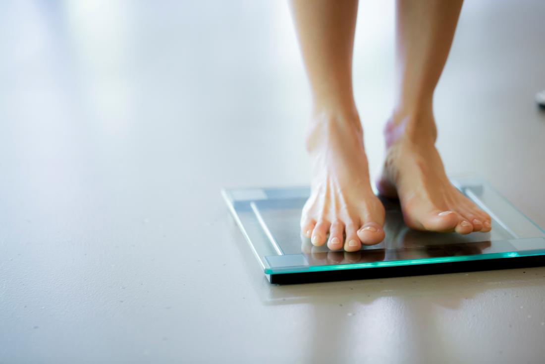 Person on weighing scales