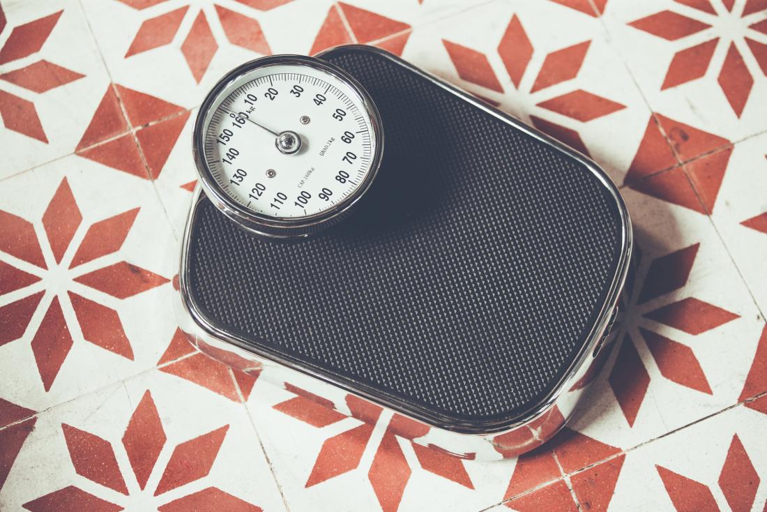 scales on tiled floor