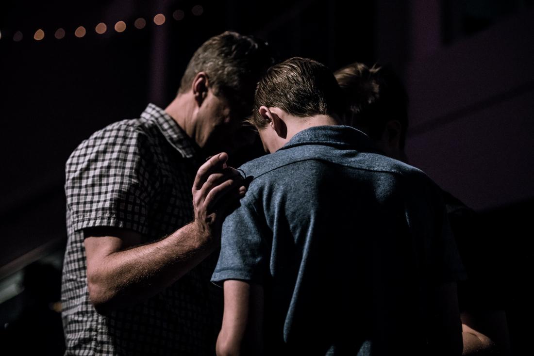 man being comforted