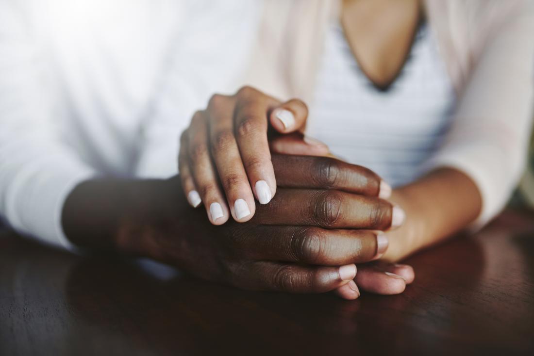 Holding hands and showing support