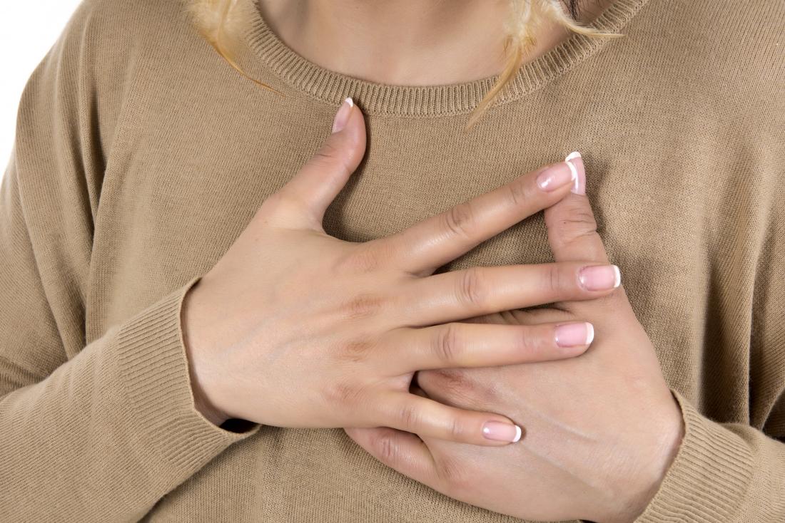 woman with hands on heart
