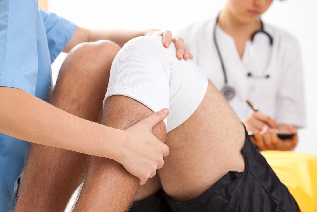 male patient with knee bandage
