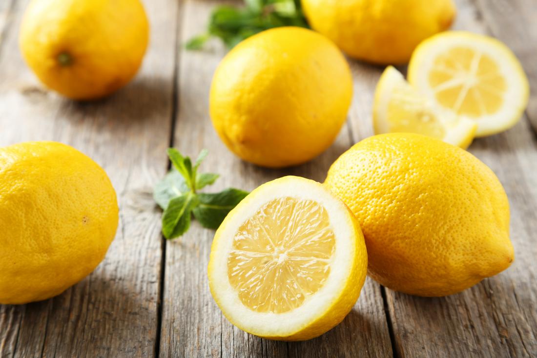 Lemons cut open on a wooden table