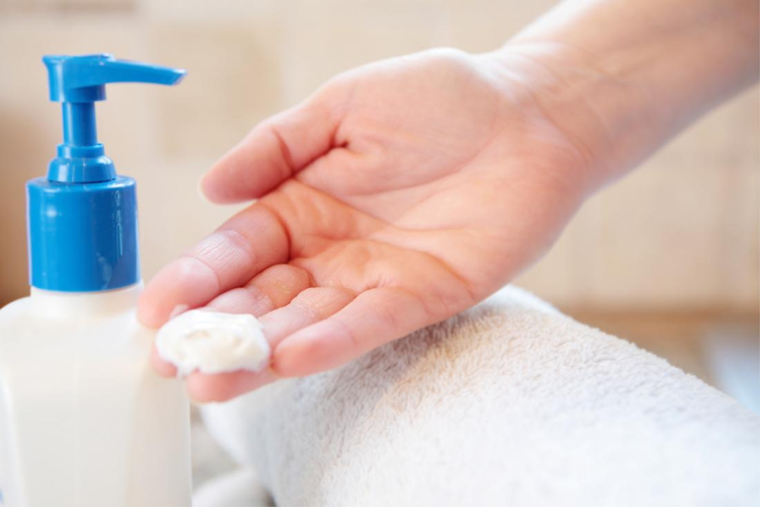 Woman with lotion on hand