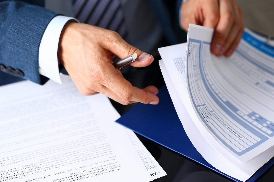 Person going through insurance paperwork