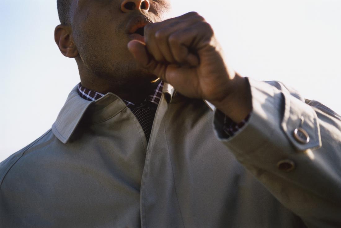 View of man coughing