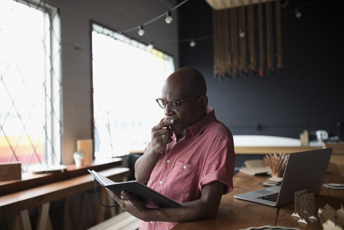 Man reading book and studying