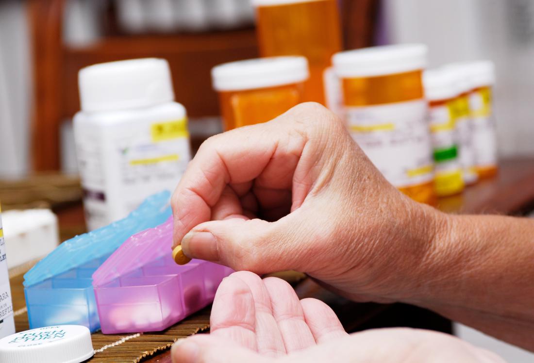 Woman organising prescription pills