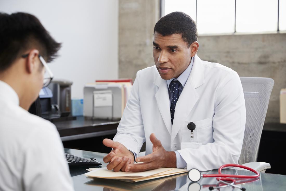 Doctor speaking with his patient