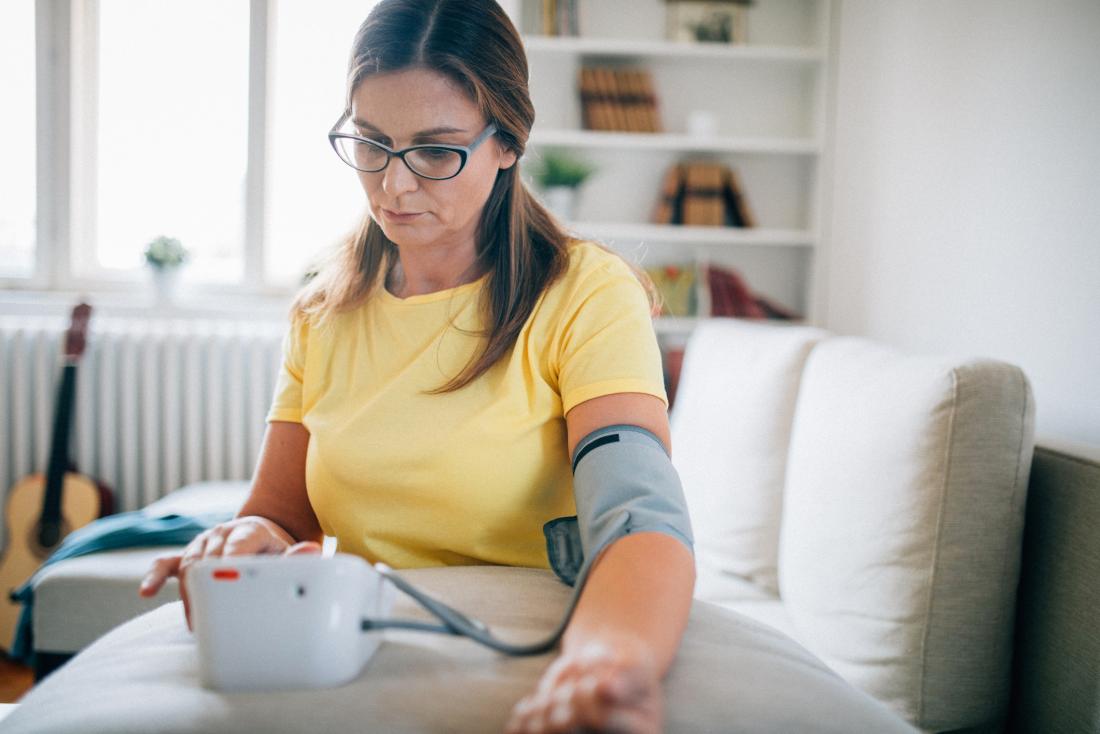 Woman checking blood pressure