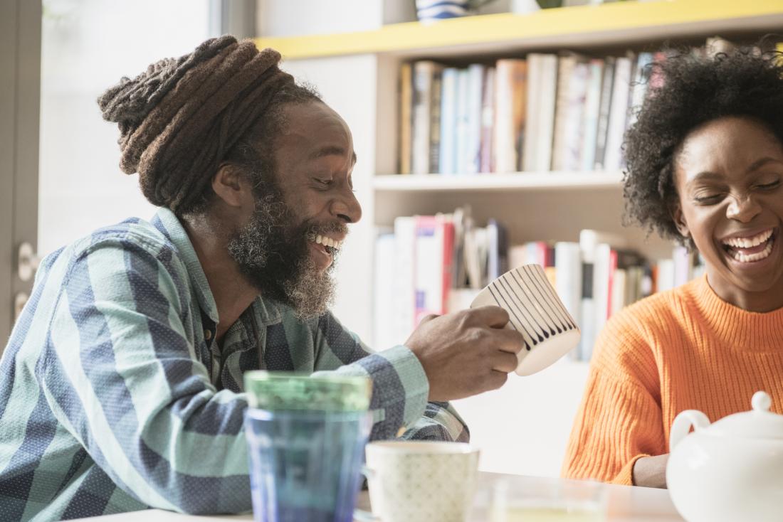 Two people talking and laughing