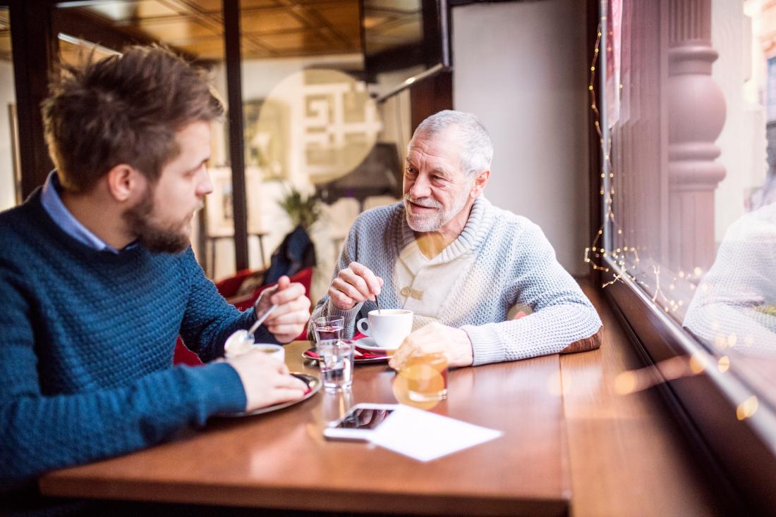 Father and son having a chat over coffee