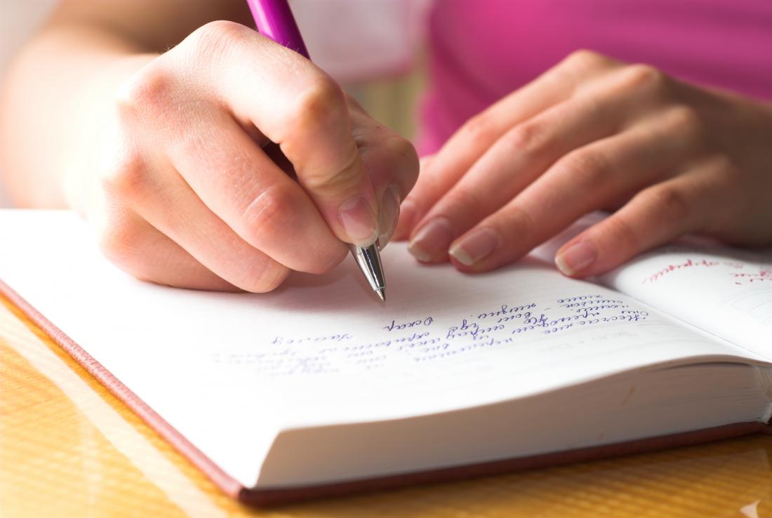 woman writing in journal