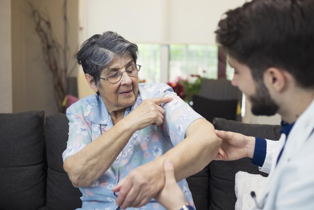 physician helping woman
