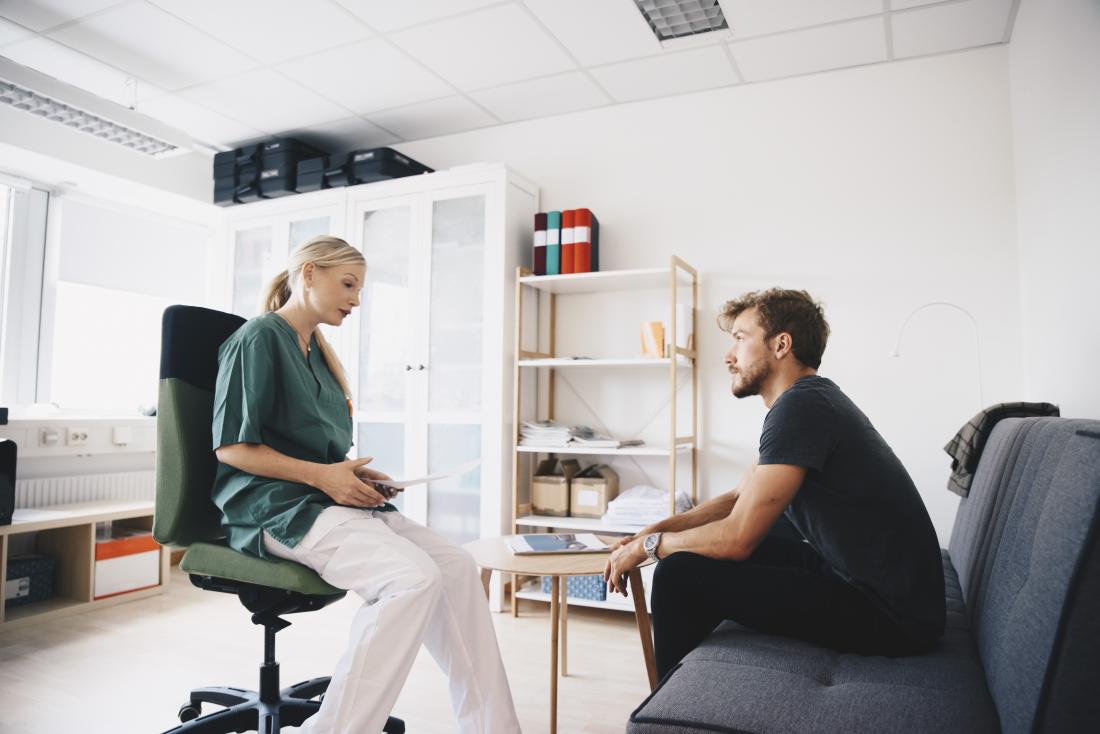doctor speaking to patient in modern office