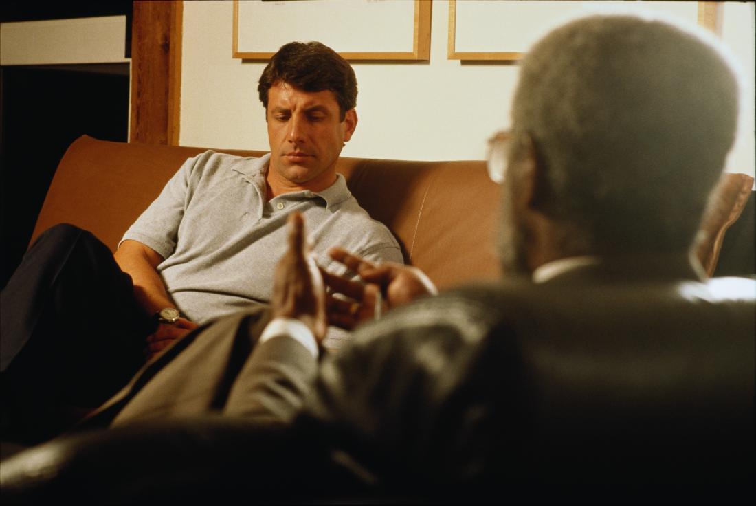 Man having therapy or counseling in psychiatrist office