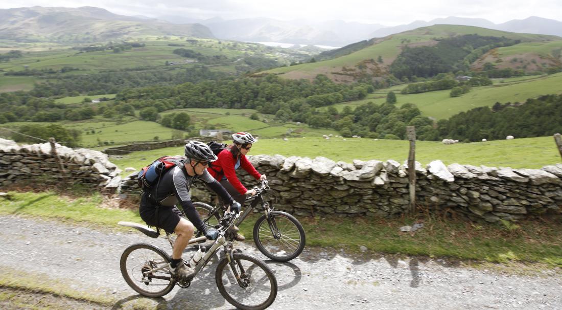 couple cycling in the country
