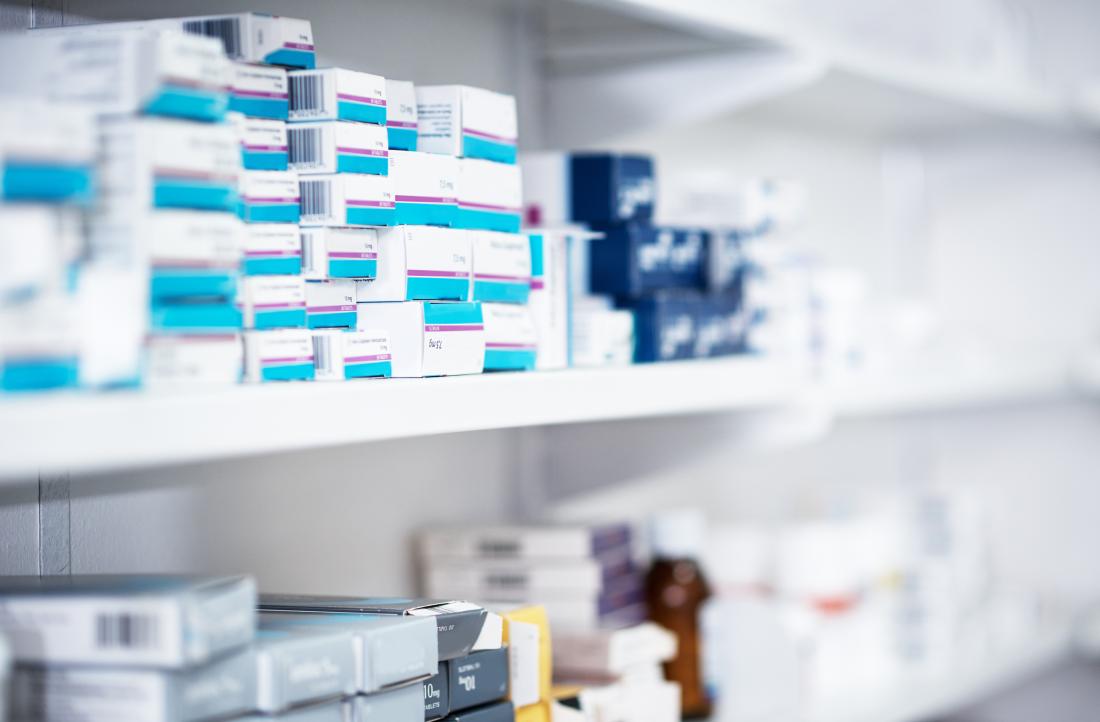 packs of medicine on pharmacy shelves
