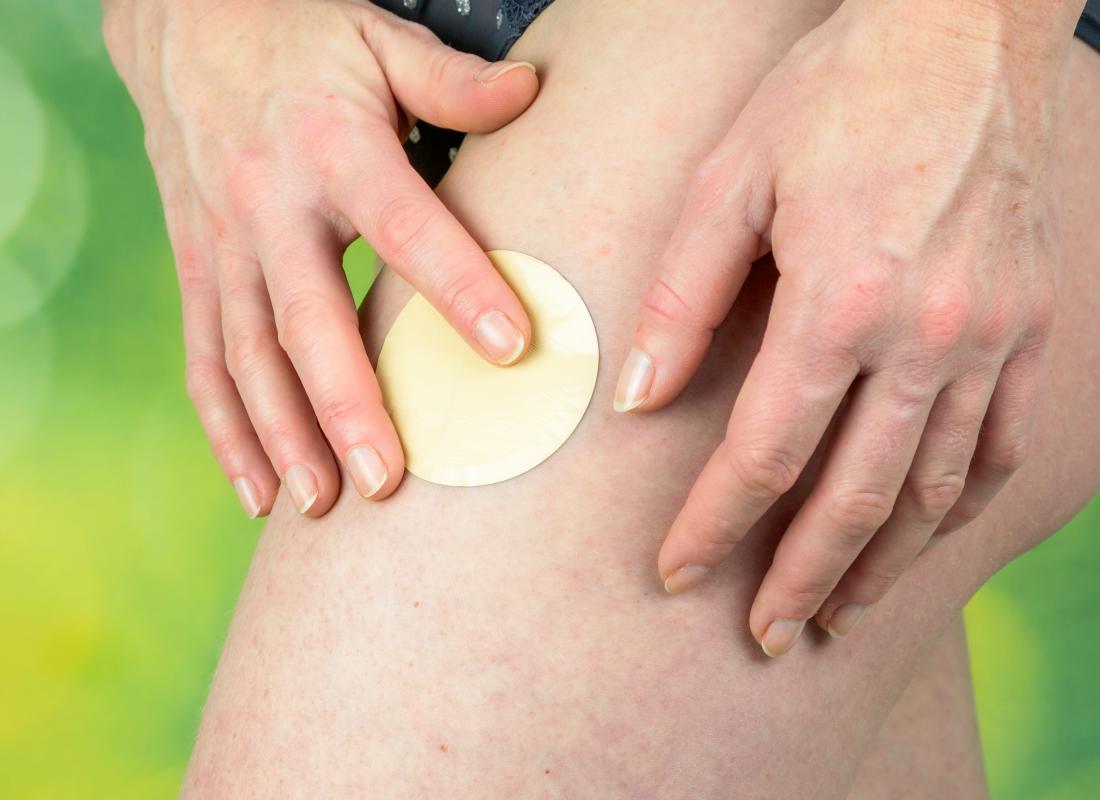 Nicotine patch being placed on a leg which may help with ulcerative colitis