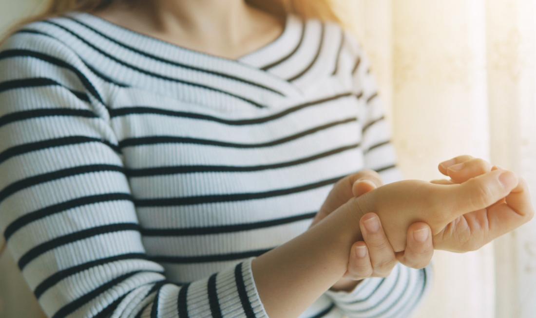 woman with pain in hand and wrist