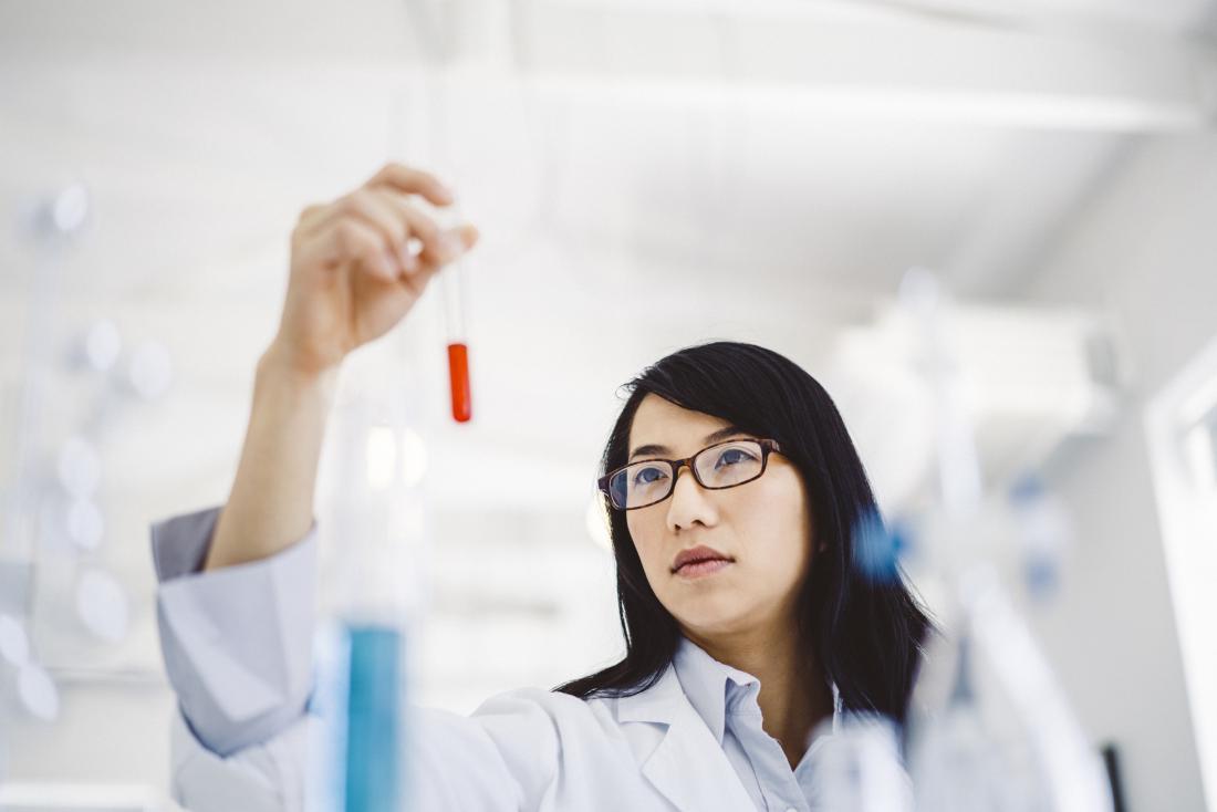 scientist looking at blood sample