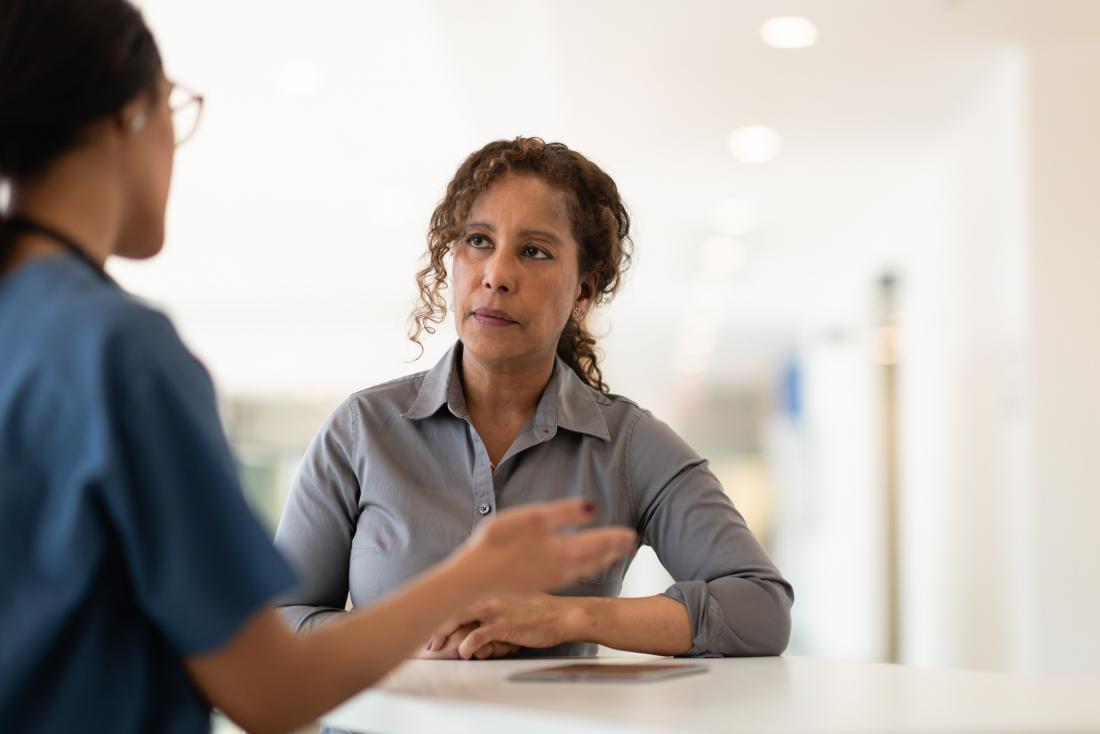 female patient listening to female doctor