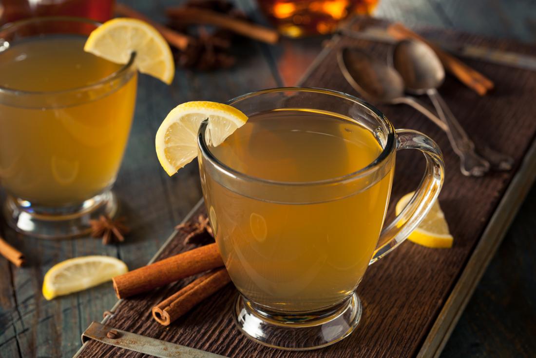 Hot toddy drink of whiskey, tea, cinnamon, lemon, sugar, and honey.