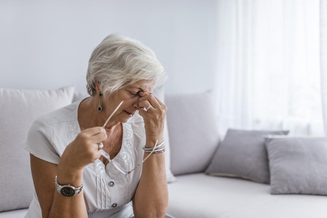 Woman with a headache and fatigue due to secondary progressive multiple sclerosis