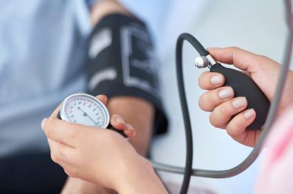 man having his blood pressure taken