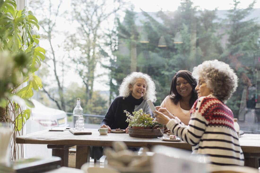 ladies socialising over food. 