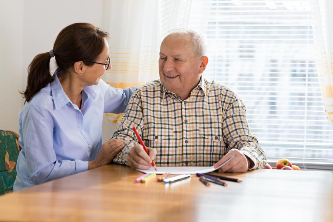 healthcare professional comforting senior man