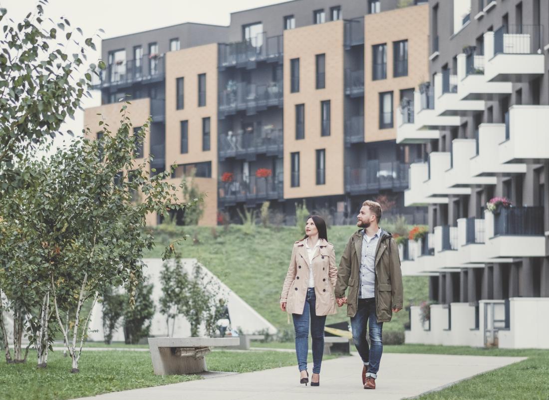Couple walking through estate