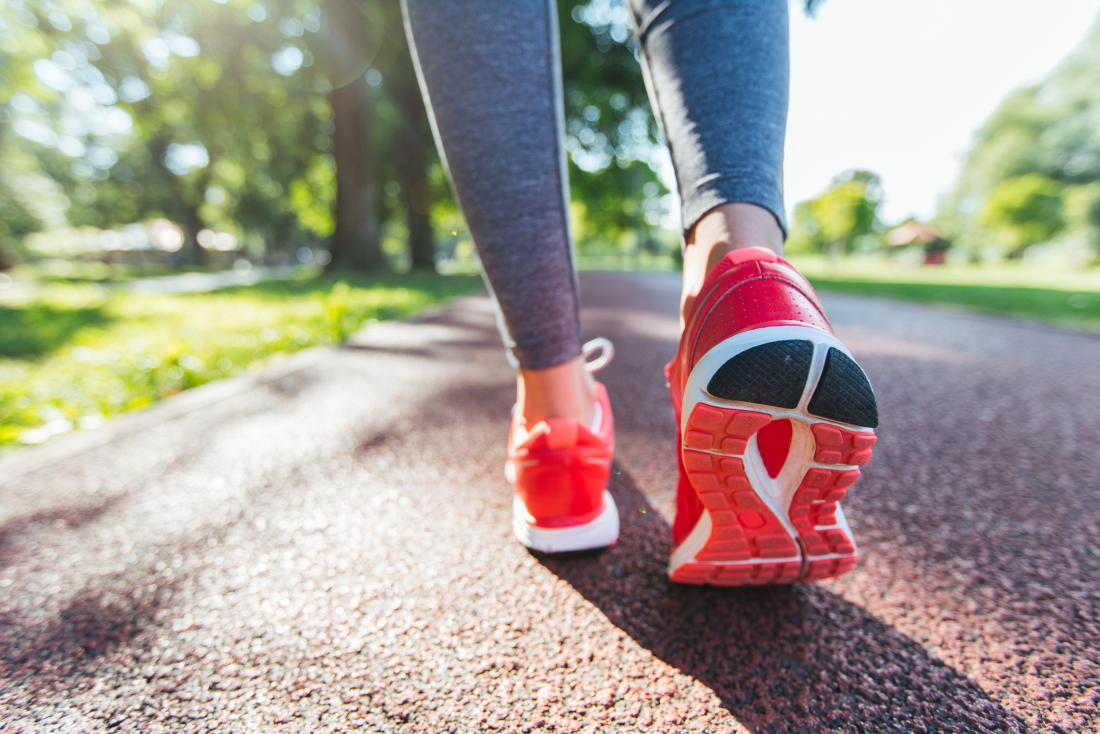 a woman running in the park
