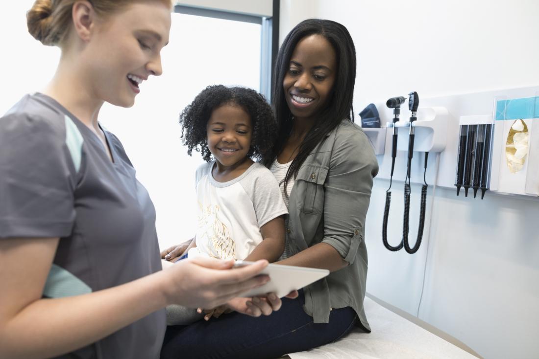 A doctor with a parent and a child.
