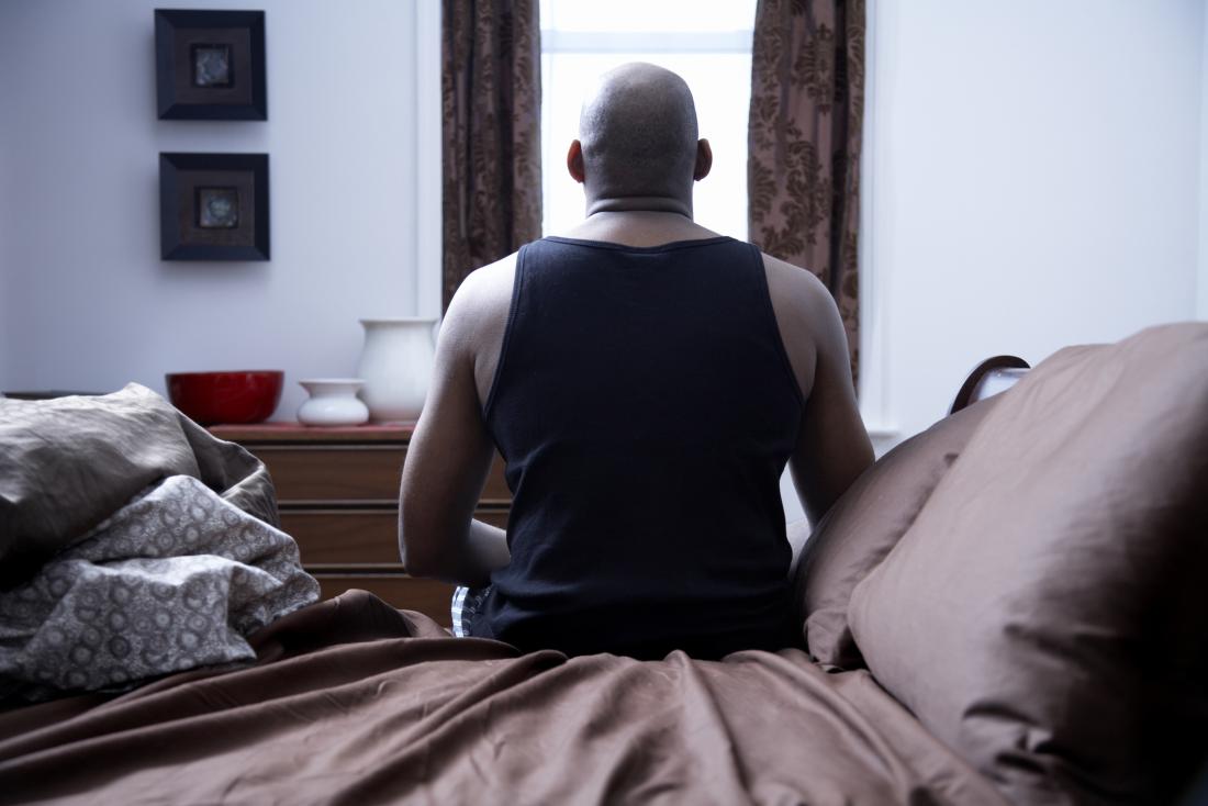 Man sitting up in bed.