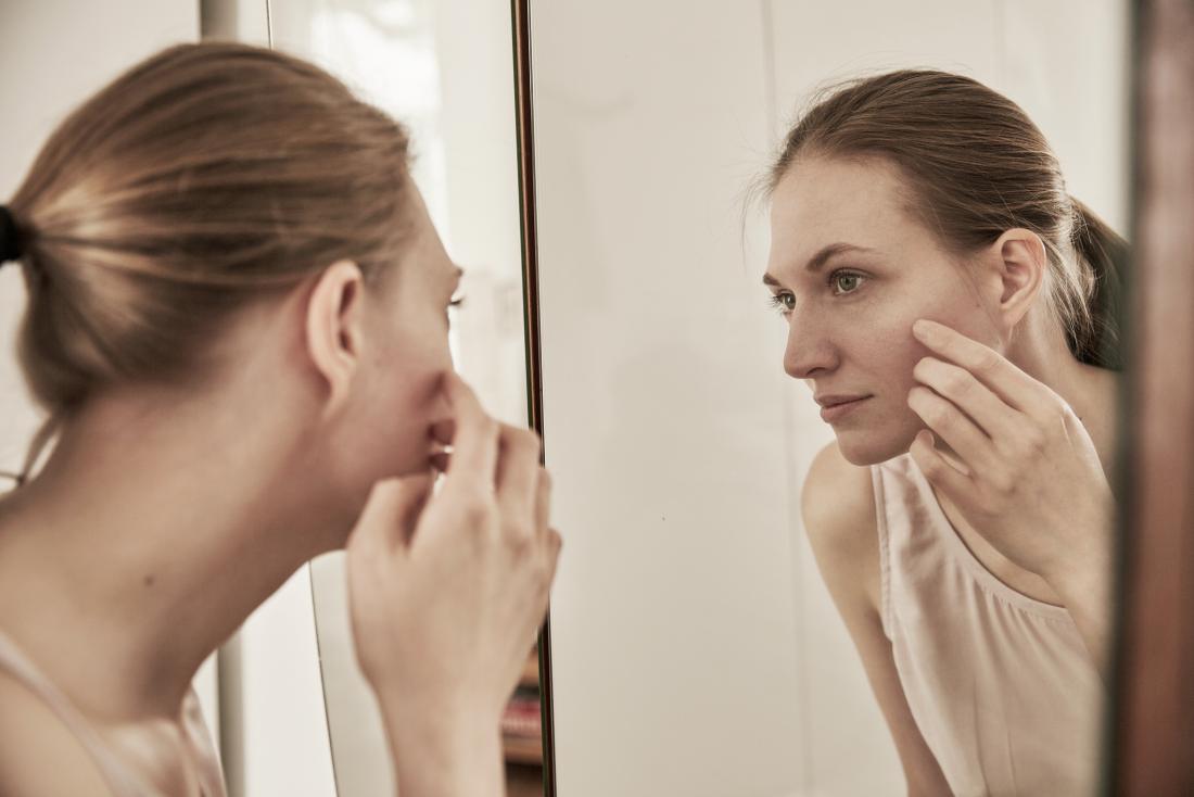 Woman With Argyria Looks In The Mirror 
