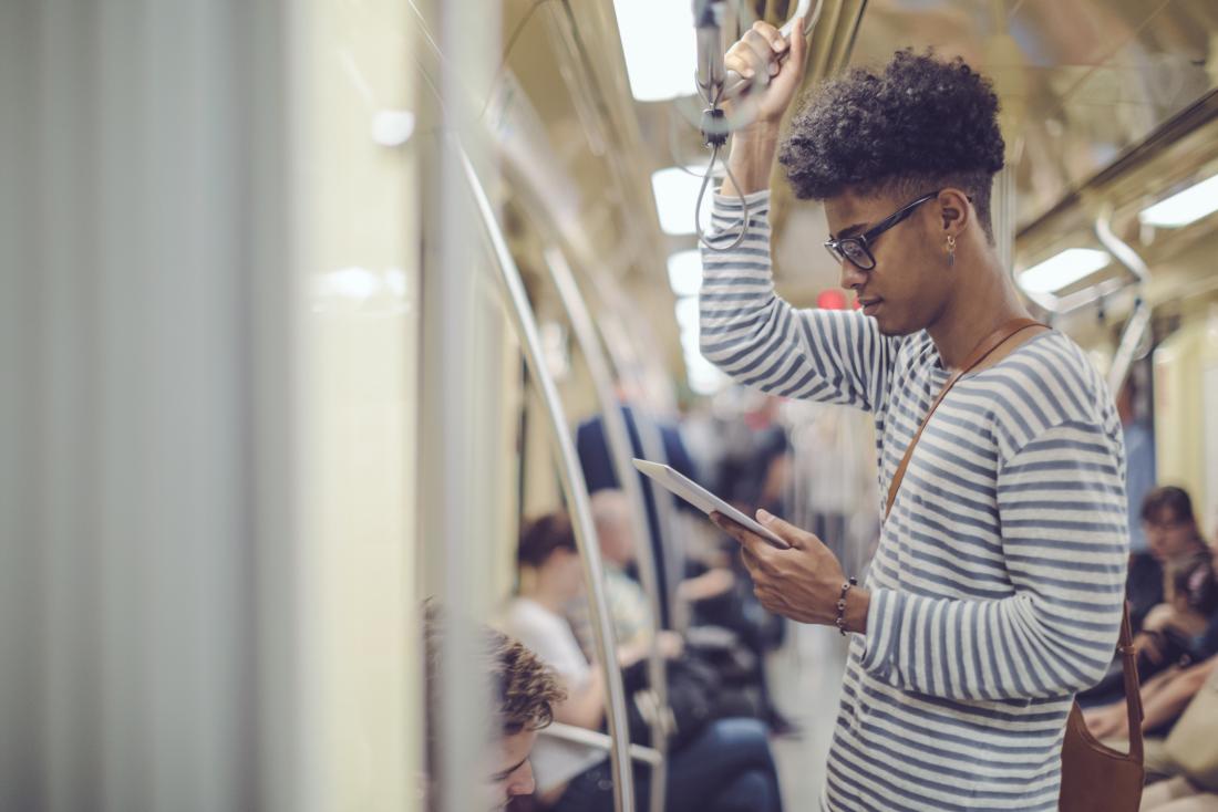 young person reading on tablet