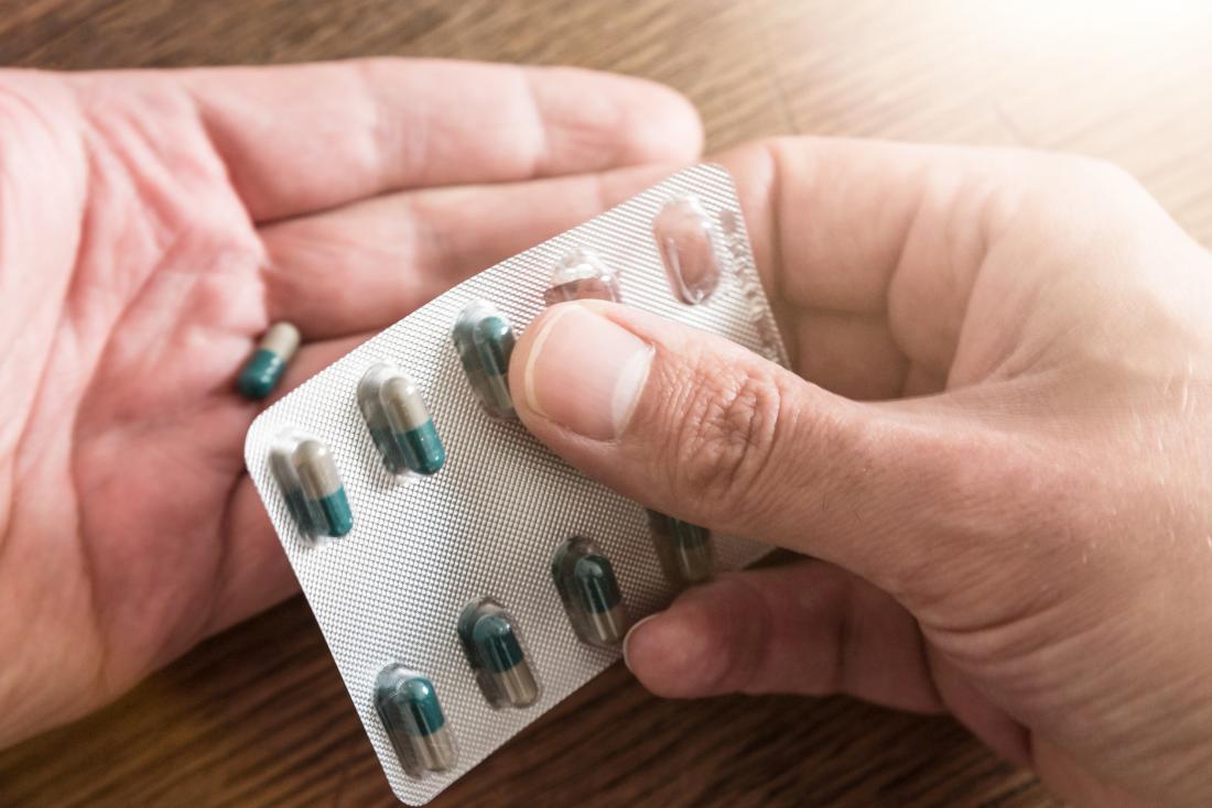 pill being removed from blister pack