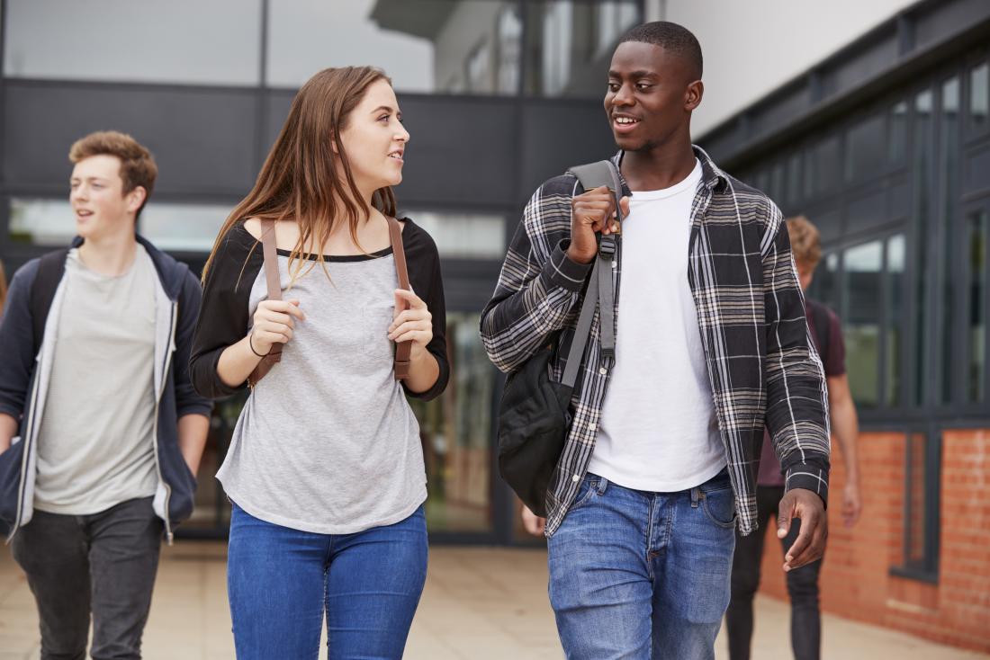 Young people walking near school, who may be at risk of side effects from Rick Simpson oil.