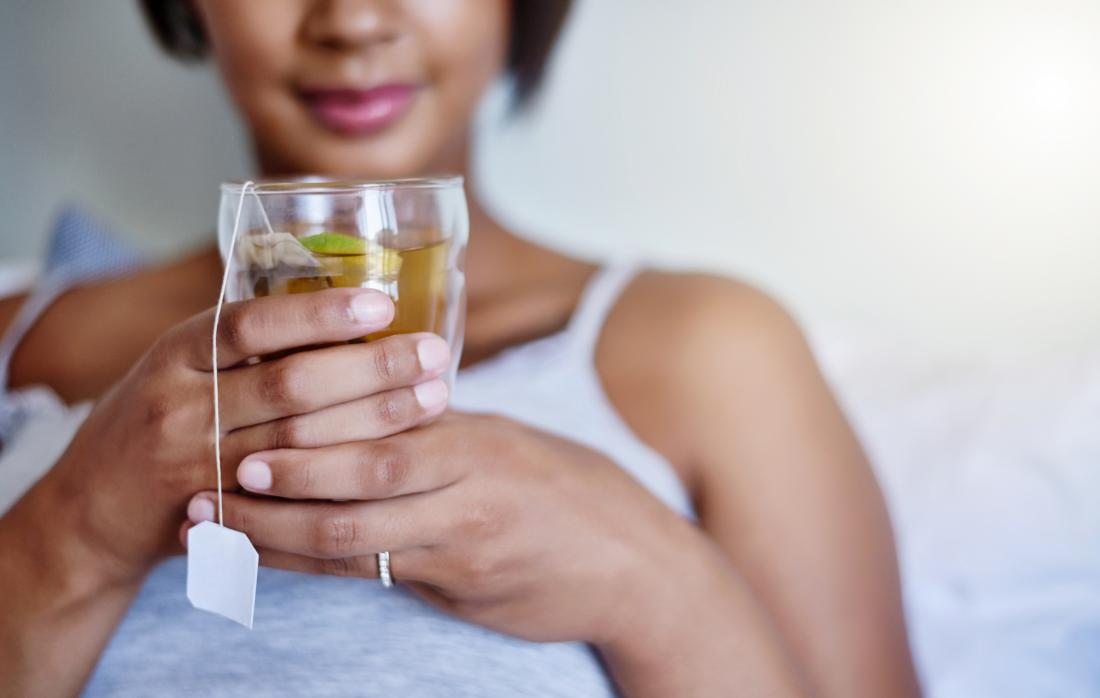 A woman drinking green tea.
