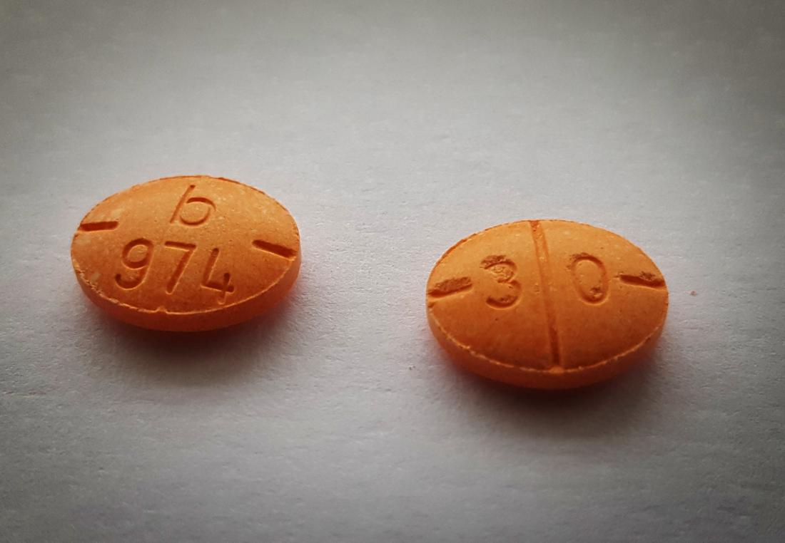 Adderall Uses Side Effects And Dosage   Two Pills Of Adderall On A Table Image Credit Dmtrott 2010 