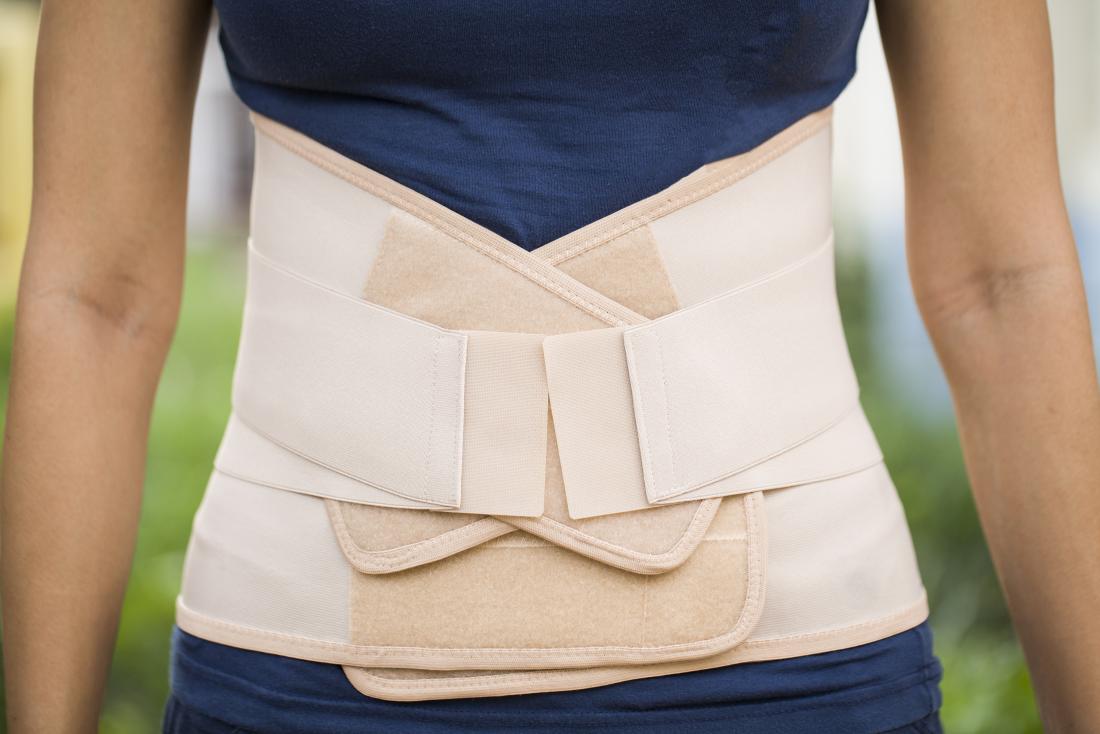 woman wearing a lower back brace