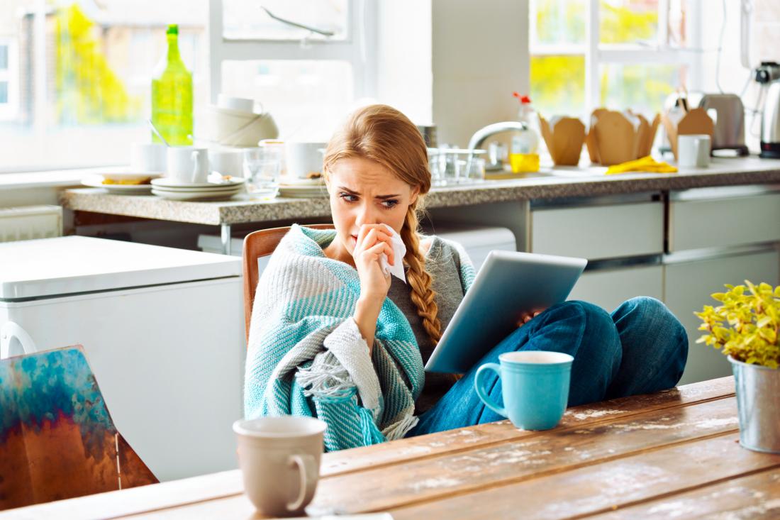 woman sneezing