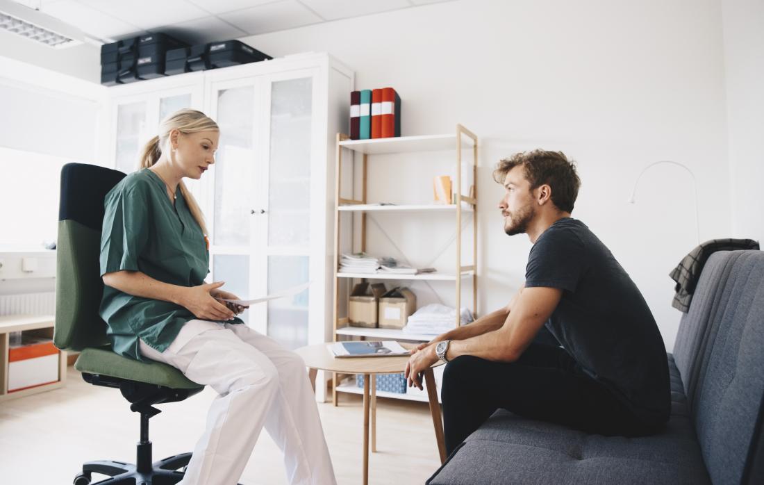 doctor speaking to patient in modern office